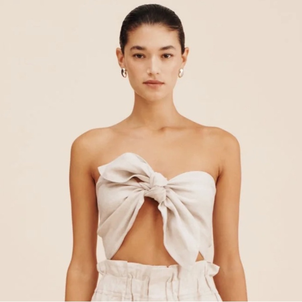 Pair of Posse Mickey Bandeau tops.Beige and Pink. Stock photos for style